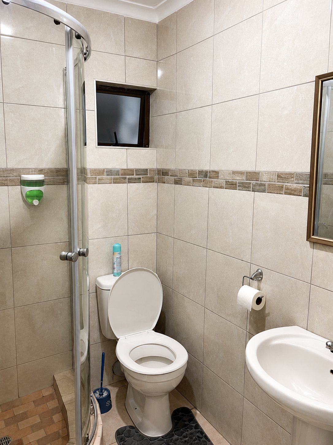 Deluxe Double Room — bathroom with curved glass shower