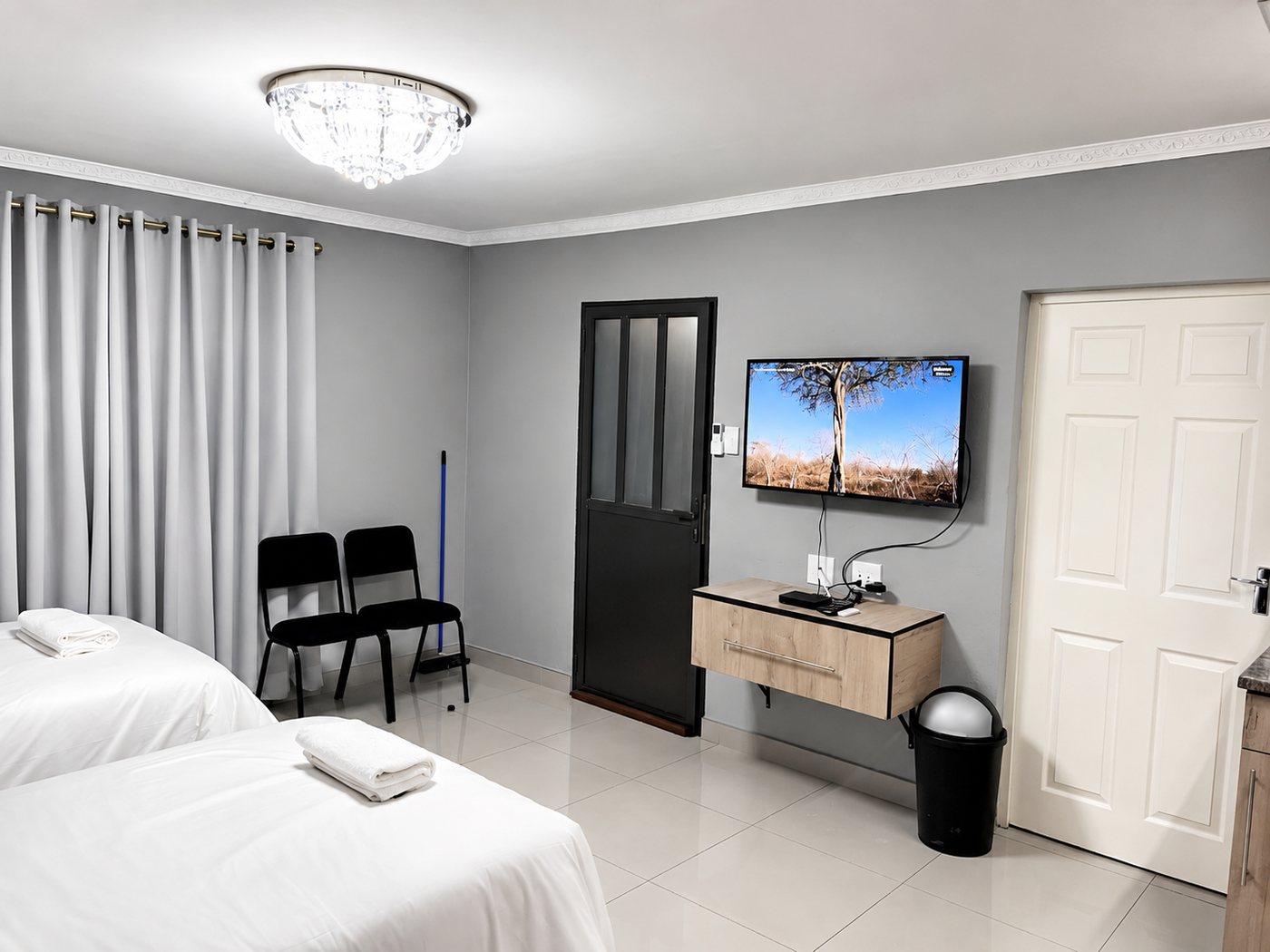 Twin / Double Room — TV wall and seating